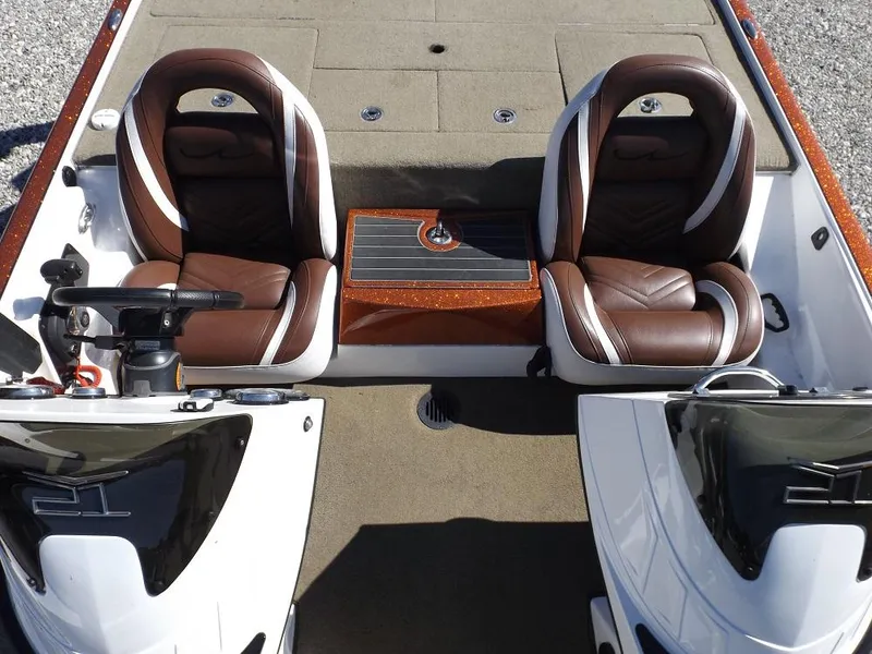 Slide: The Image of Legend V21 2017 model boat interior with two brown leather seats and a central console. - 14