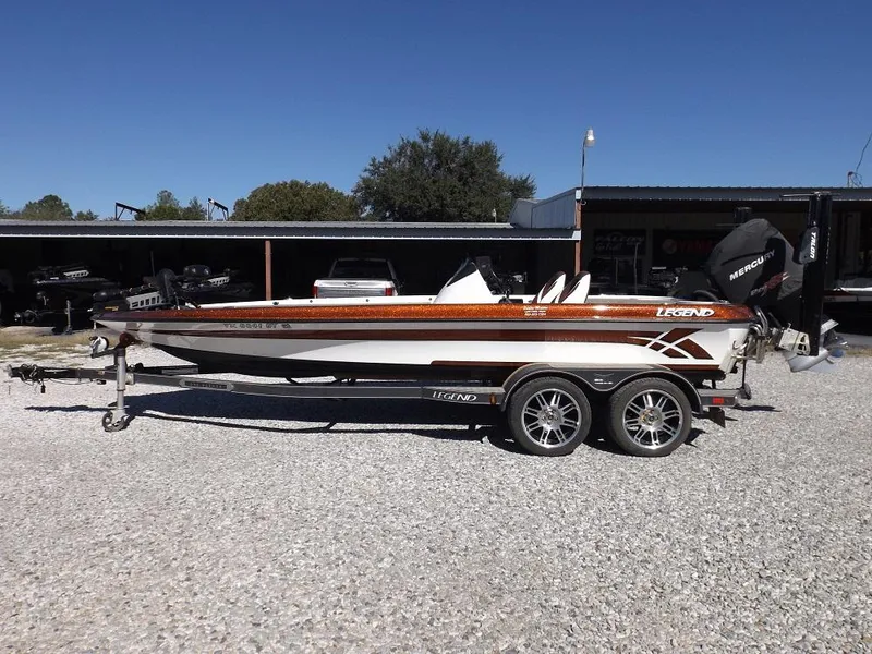 Slide: The Image of 2017 Legend V21 boat on trailer in outdoor lot. - 2