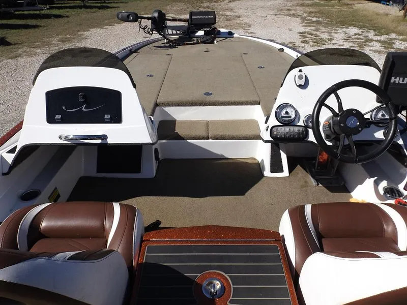 Slide: The Image of Interior of a 2017 Legend V21 boat with brown and white seating. - 20