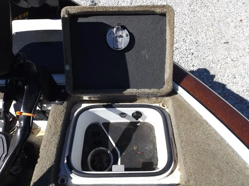 Slide: The Image of Open storage compartment on a 2017 Legend V21 boat. - 23