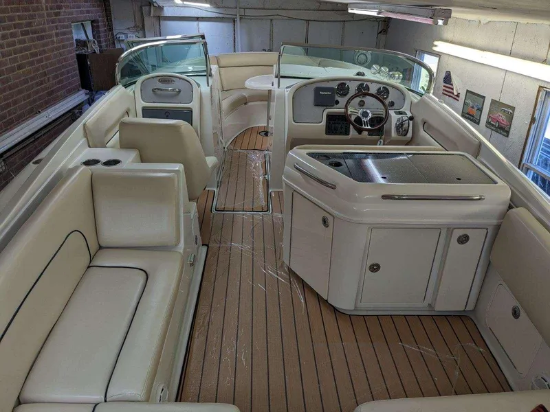 Slide: The Image of 2005 Chris-Craft Launch 28 interior with elegant seating and wooden flooring. - 5