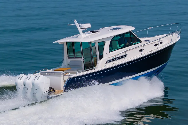 The Image of 2025 Back Cove 39O cruising on open water, showcasing sleek design and powerful engines. - 1