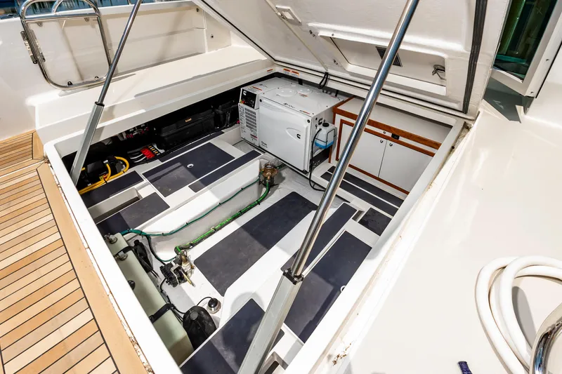 Slide: The Image of Engine compartment of 2025 Back Cove 39O boat, showcasing modern equipment and storage. - 12