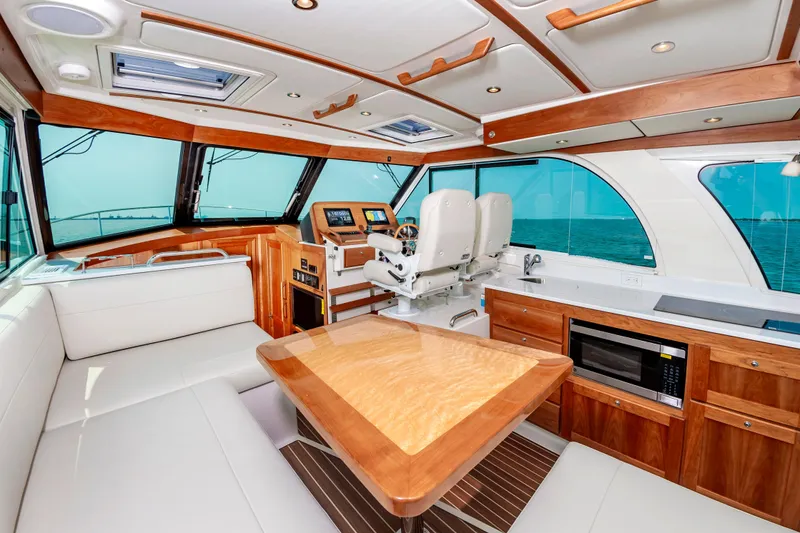 Slide: The Image of Luxurious interior of 2025 Back Cove 39O yacht with modern kitchen and seating area. - 14