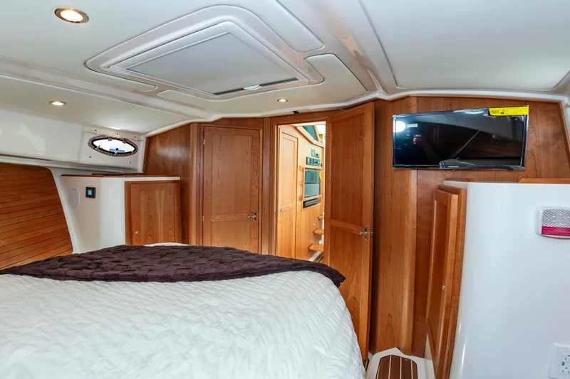 Slide: The Image of Luxurious cabin interior of 2025 Back Cove 39O yacht with wood finish and modern amenities. - 29