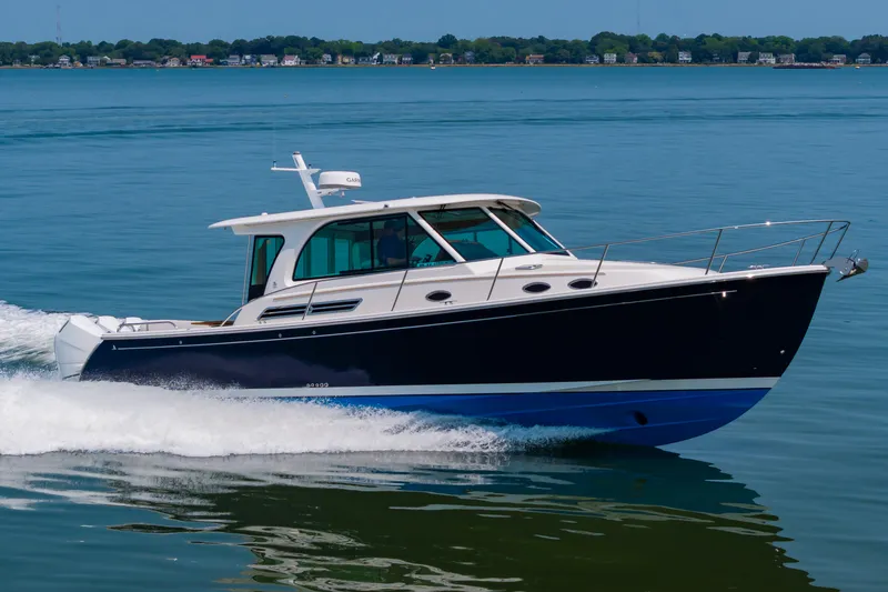 Slide: The Image of 2025 Back Cove 39O cruising on calm blue waters. - 3