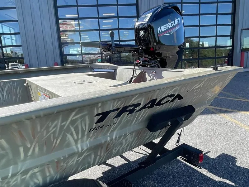 Slide: The Image of 2024 Tracker GRIZZLY® 1754 Jon boat with Mercury outboard motor. - 11