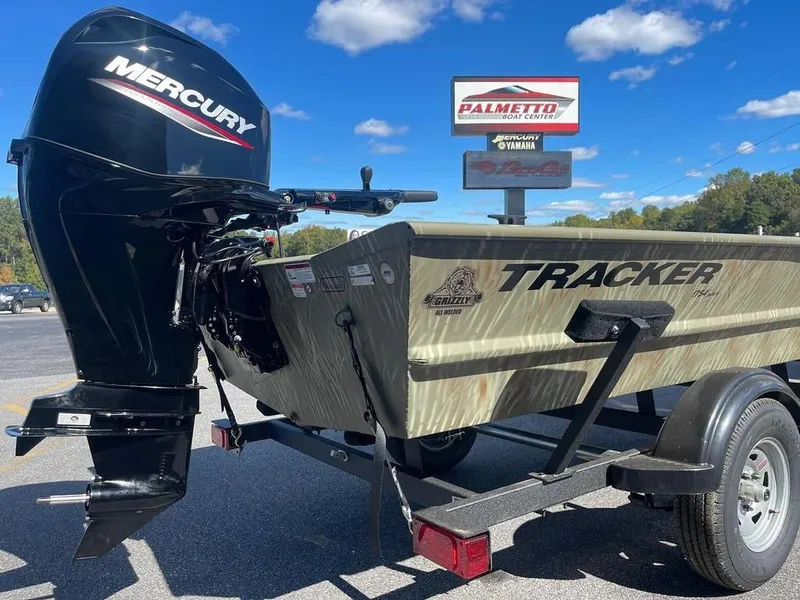 Slide: The Image of 2024 Tracker GRIZZLY® 1754 Jon boat with Mercury outboard motor. - 13