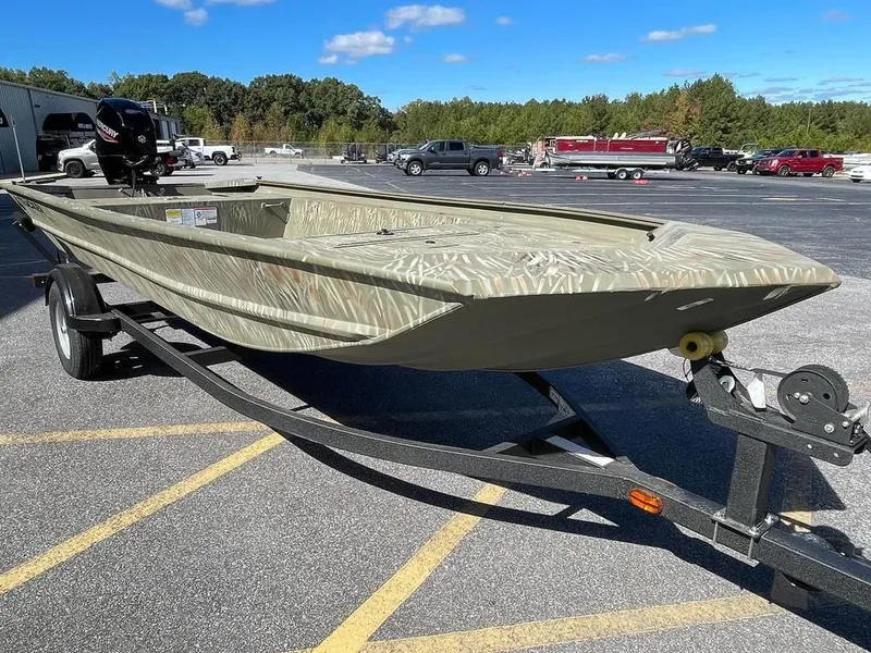 Slide: The Image of 2024 Tracker GRIZZLY® 1754 Jon boat on a trailer in a parking lot. - 7