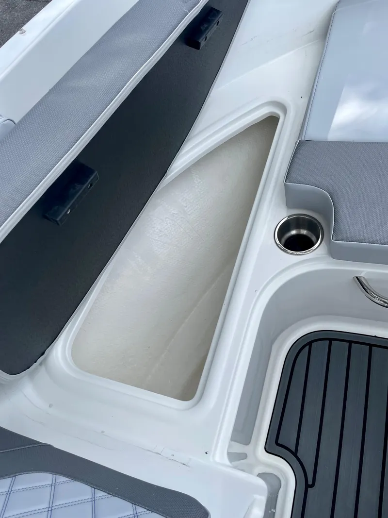 Slide: The Image of 2024 Bayliner VR4 boat storage compartment and seating area. - 15
