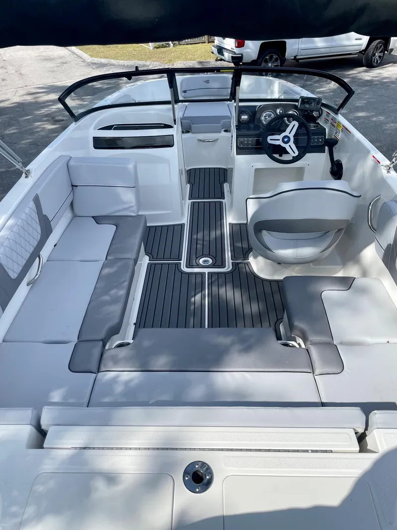 Slide: The Image of 2024 Bayliner VR4 boat interior with seating and steering wheel. - 3