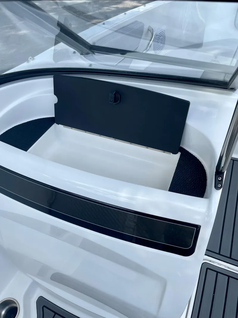 Slide: The Image of 2024 Bayliner VR4 boat interior storage compartment with open hatch. - 8