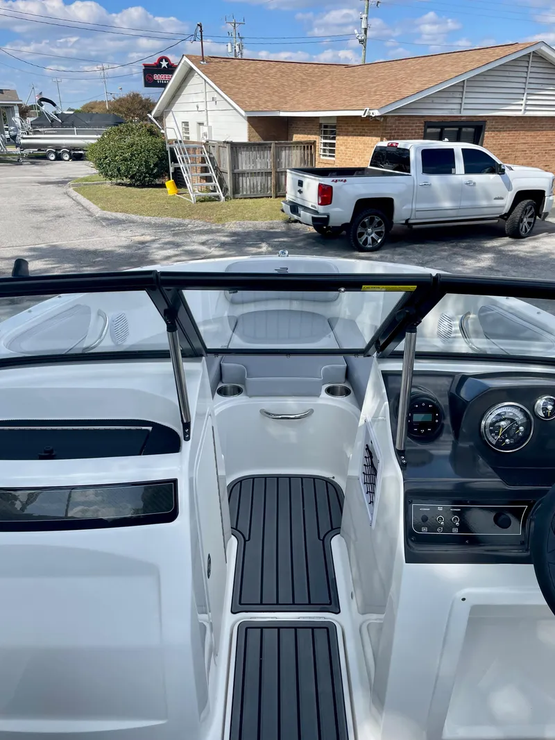 Slide: The Image of 2024 Bayliner VR4 boat interior with dashboard and seating area. - 9