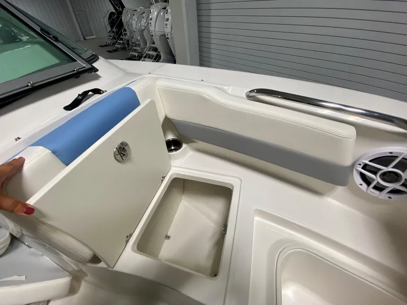 Slide: The Image of 2024 Robalo R207 Dual Console boat interior storage compartment. - 22
