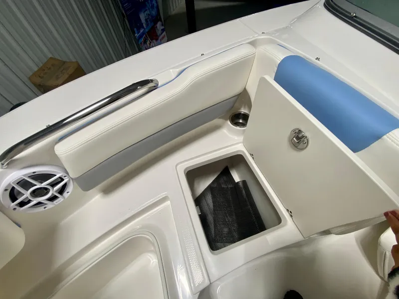 Slide: The Image of 2024 Robalo R207 Dual Console boat interior storage compartment and seating area. - 23