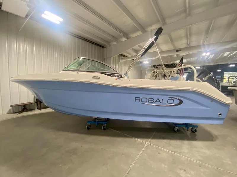 The Image of 2024 Robalo R207 Dual Console boat in indoor showroom. - 0