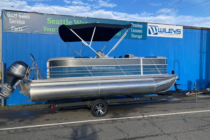The Image of 2024 Berkshire 20RFX LE pontoon boat on trailer outside Wiley's shop. - 0