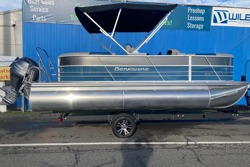 Slide: The Image of 2024 Berkshire 20RFX LE pontoon boat with canopy on trailer. - 2