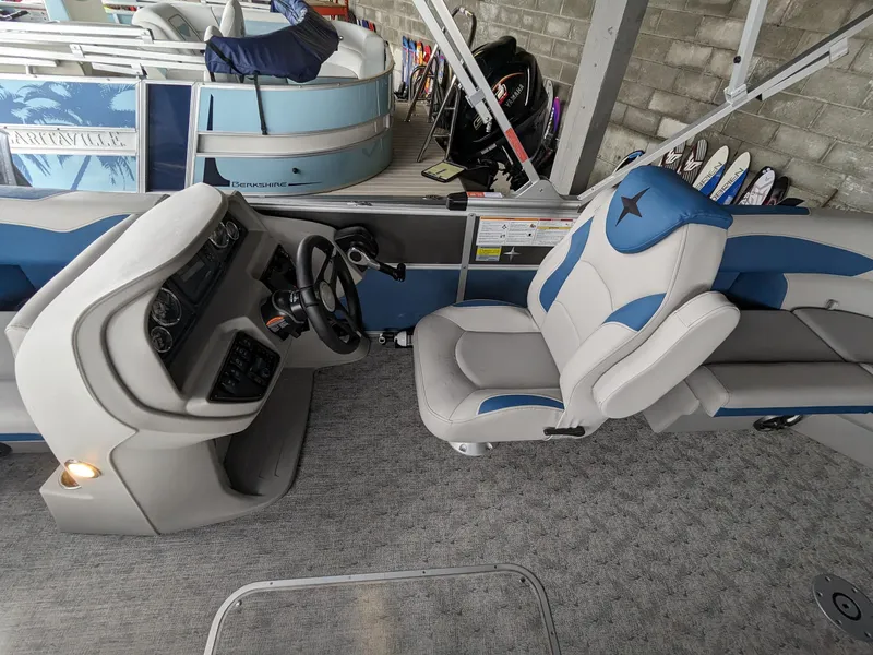Slide: The Image of 2024 Berkshire 20RFX LE boat interior with captain's chair and dashboard. - 4
