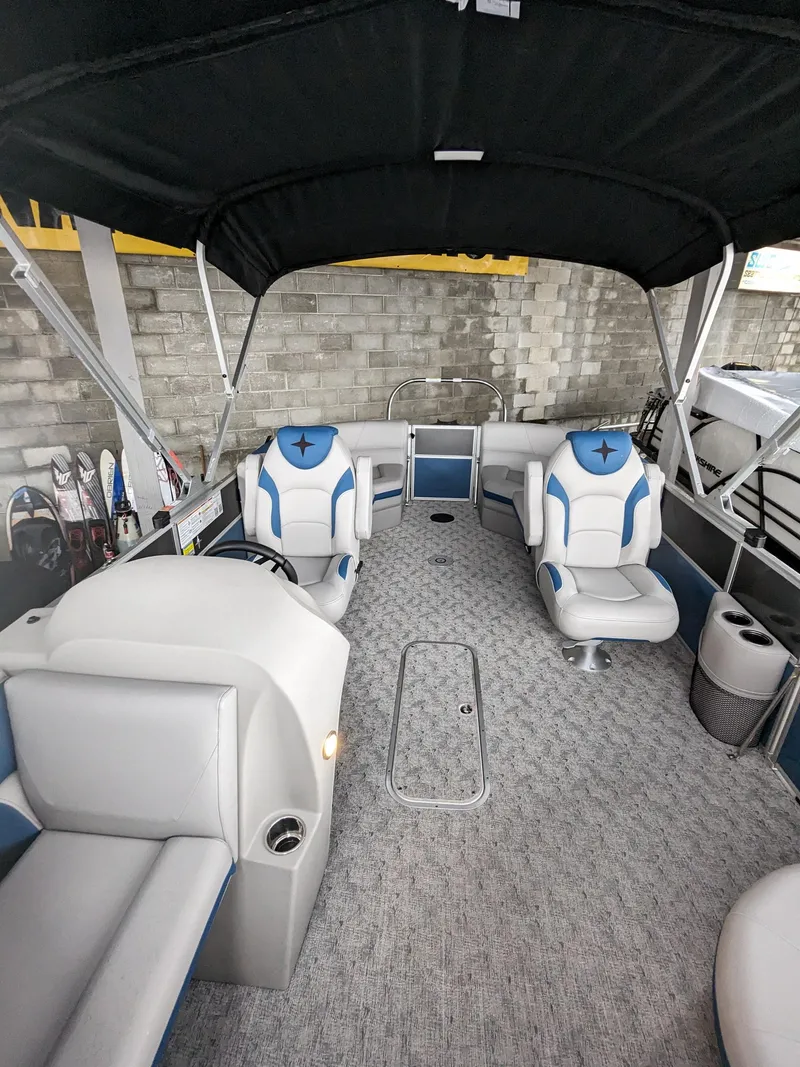 Slide: The Image of 2024 Berkshire 20RFX LE pontoon boat interior with seating and canopy. - 5