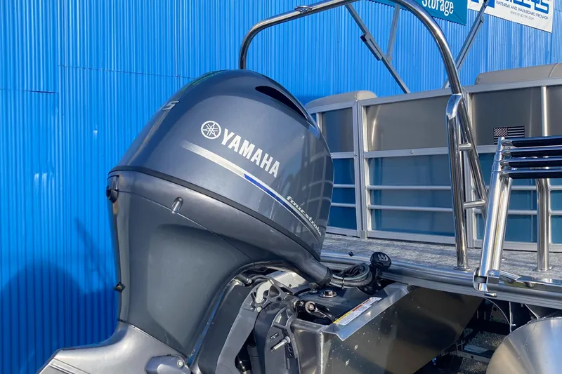 Slide: The Image of 2024 Berkshire 20RFX LE pontoon boat with Yamaha outboard motor. - 9