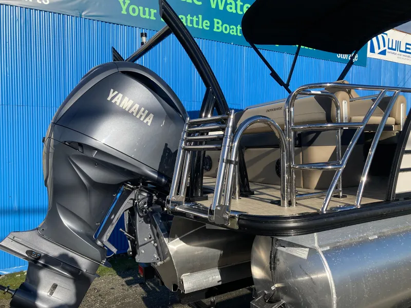 Slide: The Image of 2024 Berkshire 23ULE STS pontoon boat with Yamaha outboard motor. - 2
