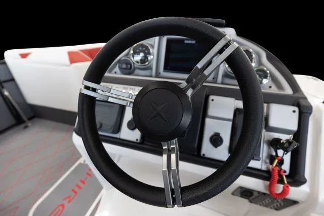 Slide: The Image of 2024 Berkshire 23ULE STS boat steering wheel and dashboard. - 5