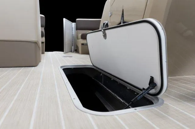 Slide: The Image of 2024 Berkshire 23ULE STS boat with open floor storage compartment. - 9