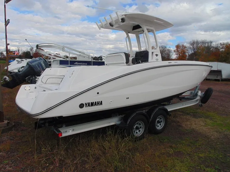 Slide: The Image of 2022 Yamaha Boats 252 FSH® SPORT on trailer, side view. - 13