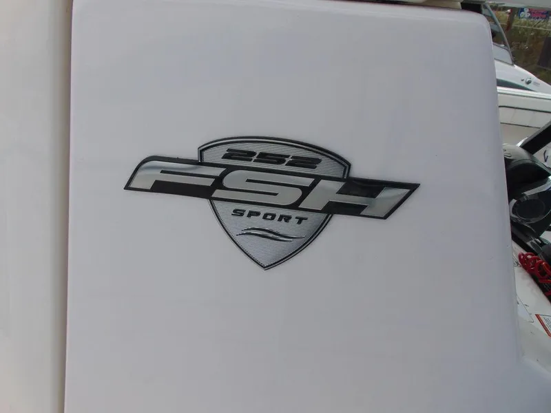 Slide: The Image of 2022 Yamaha Boats 252 FSH® SPORT logo on white surface. - 6