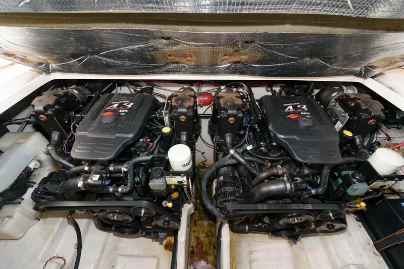 Slide: The Image of Twin engines of a 2005 Sea Ray 280 Sundancer boat. - 12