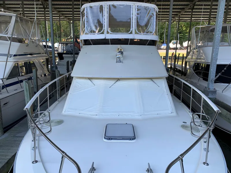 Slide: The Image of 1982 Trojan F 40 yacht docked in a marina. - 11