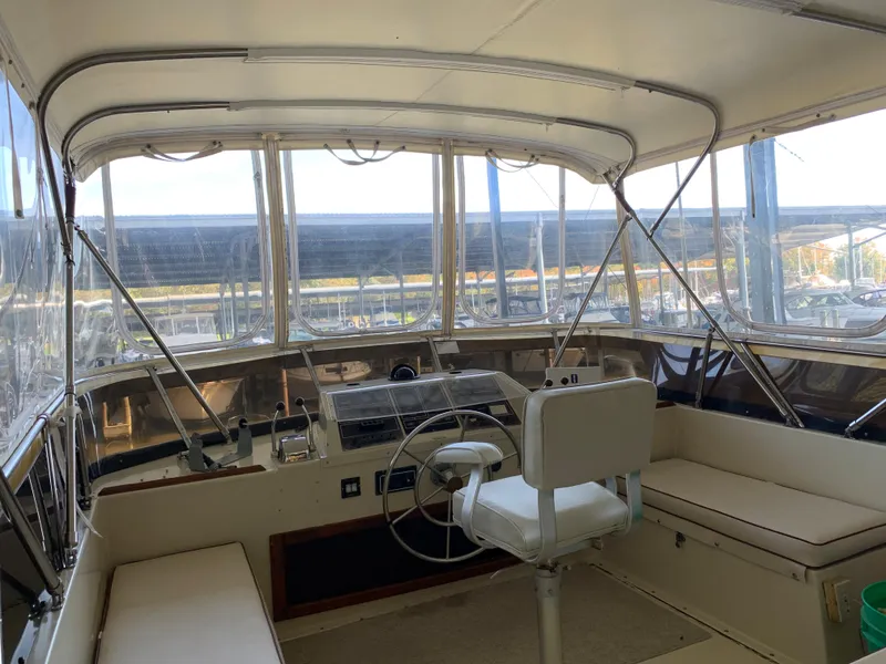 Slide: The Image of 1982 Trojan F 40 boat interior with helm and seating area. - 17