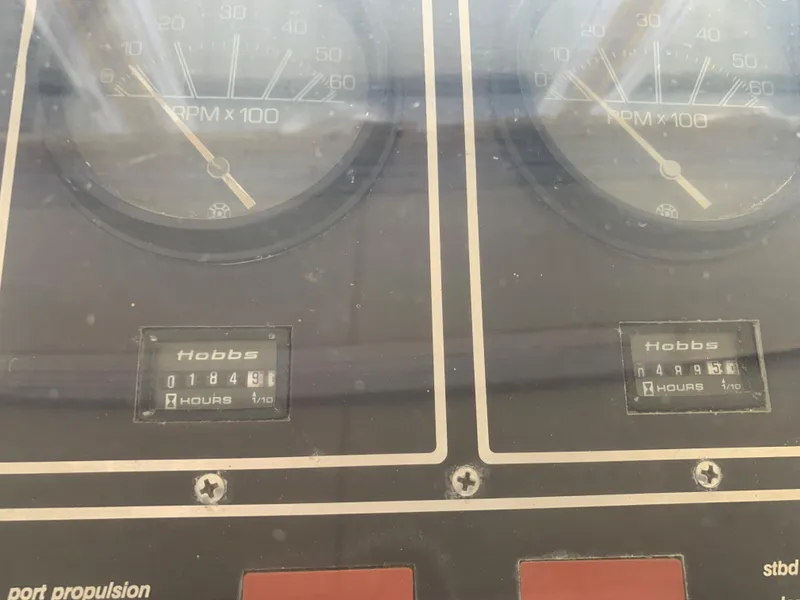 Slide: The Image of 1982 Trojan F 40 boat dashboard with RPM and Hobbs hour meters - 19