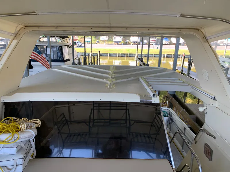 Slide: The Image of 1982 Trojan F 40 yacht docked, interior view with American flag. - 20