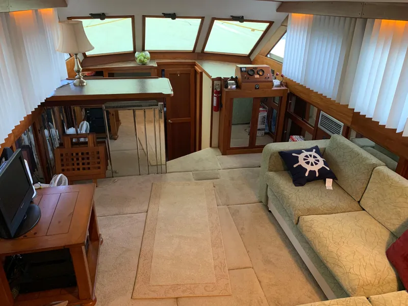 Slide: The Image of Interior of a 1982 Trojan F 40 yacht with cozy seating and nautical decor. - 22