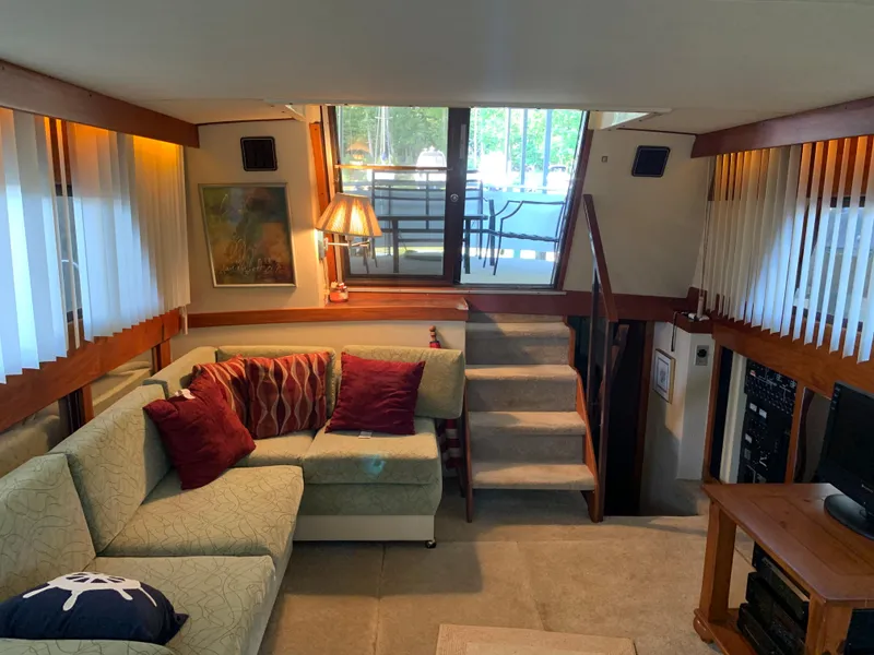 Slide: The Image of Interior of 1982 Trojan F 40 yacht with cozy seating area and stairs. - 23