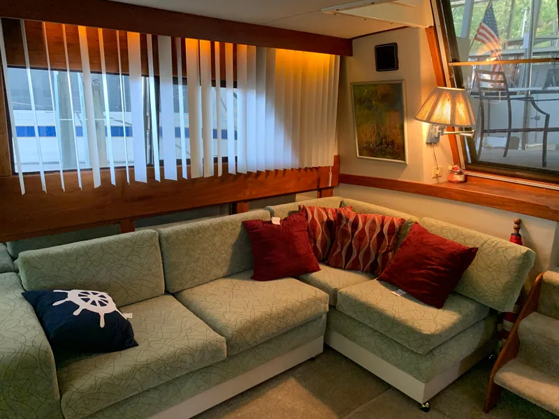 Slide: The Image of Interior of 1982 Trojan F 40 yacht with cozy seating area and decorative pillows. - 24