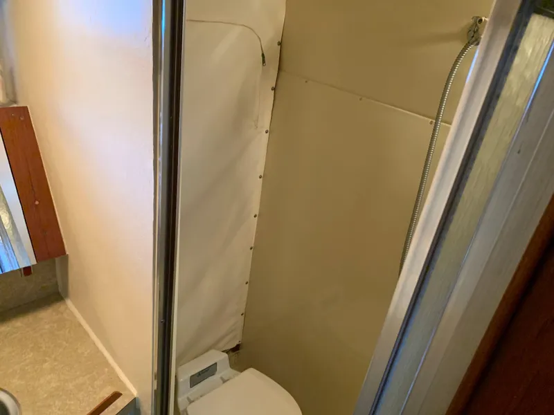 Slide: The Image of 1982 Trojan F 40 boat bathroom with shower and toilet. - 34