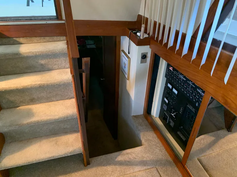 Slide: The Image of Interior of 1982 Trojan F 40 yacht with carpeted stairs and control panel. - 37