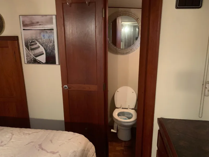 Slide: The Image of 1982 Trojan F 40 boat interior with bedroom and bathroom. - 42