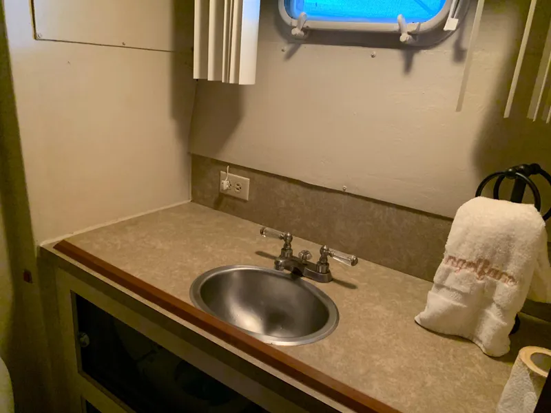 Slide: The Image of 1982 Trojan F 40 boat bathroom sink with countertop and towel - 43