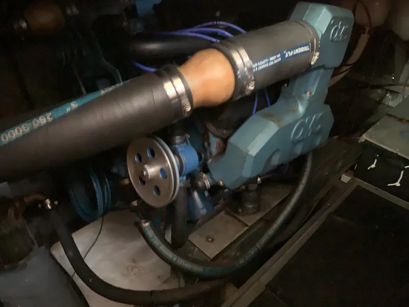 Slide: The Image of 1982 Trojan F 40 engine compartment with hoses and mechanical components. - 45