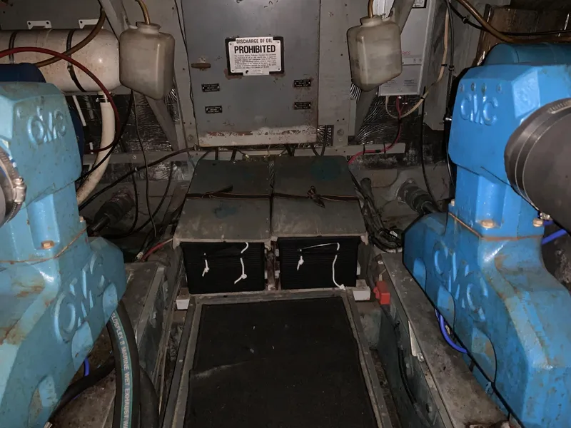 Slide: The Image of Engine room of a 1982 Trojan F 40 boat with twin engines and batteries. - 47