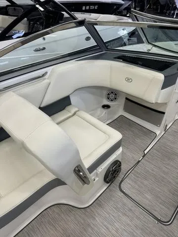 Slide: The Image of 2022 Cobalt 220S boat interior with white leather seating and modern design. - 11