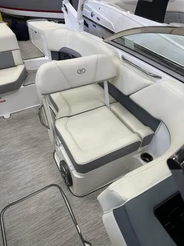 Slide: The Image of 2022 Cobalt 220S boat interior with white and gray seating. - 12