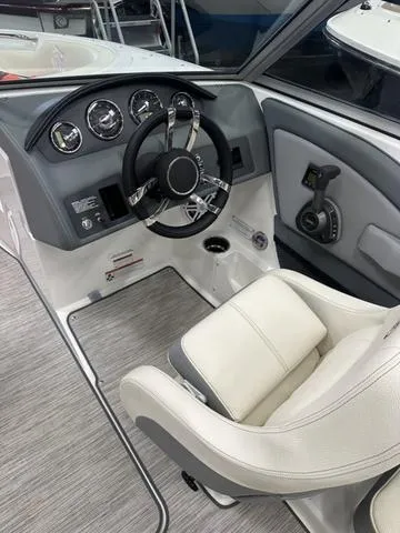 Slide: The Image of 2022 Cobalt 220S boat interior with steering wheel and captain's seat. - 4