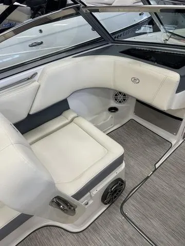 Slide: The Image of 2022 Cobalt 220S boat interior with white leather seating and modern design. - 8