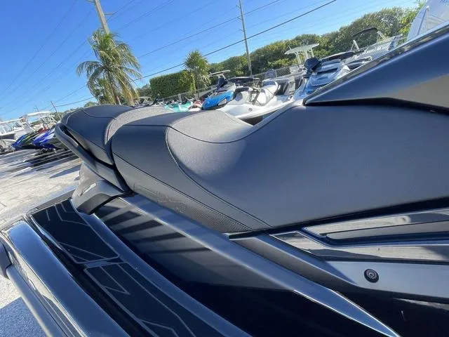 Slide: The Image of 2024 Yamaha Waverunner FX SVHO® with Audio System, sleek black design, side view. - 13