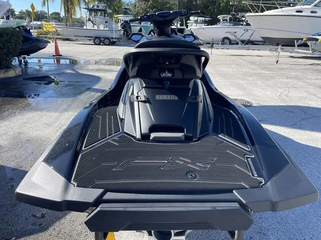 Slide: The Image of 2024 Yamaha Waverunner FX SVHO® with Audio System, rear view at marina. - 7